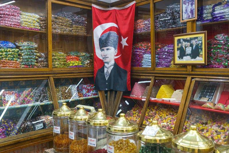 Mustafa Kemal Atatürk, the founder of modern Turkey. “Altan Sekerleme” works as traditional Ottoman style confectioners. Turkish delight, hard candy, marzipan, cheese sugar, sherbet sugar, halva varieties and Ottoman drinks called sherbets are their main products. They still continue to produce boutique traditional production. They make the candies in their own factory. The workshop is on the upper floor of the shop. The shop has been in the same place for over 150 years. In Eminönü Kantarcılar, Istanbul Turkey 2021.