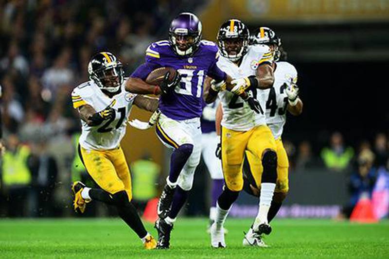 Minnesota Vikings wide receiver Jerome Simpson, centre, holds off Jonathan Dwyer and Cortez Allen of the Pittsburgh Steelers during their NFL game played at Wembley Stadium on Sunday. Jamie McDonald / Getty Images 