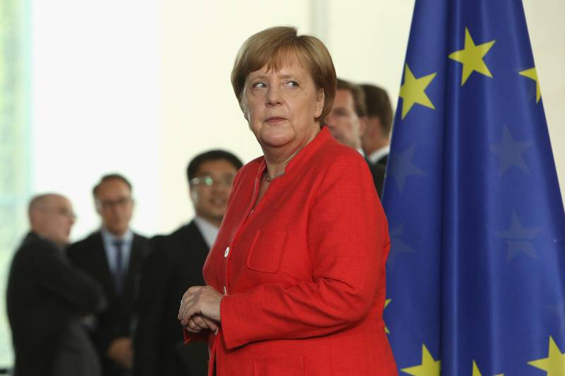 epa06875881 German Chancellor Angela Merkel attends a signing ceremony with Chinese Premier Li Keqiang (unseen) of various business agreements at the Chancellery in Berlin, Germany, 09 July 2018. The main topic of the intergovernmental consultations will be the deepening of German-Chinese cooperation with a special focus on questions of economic exchange.  EPA/ADAM BERRY