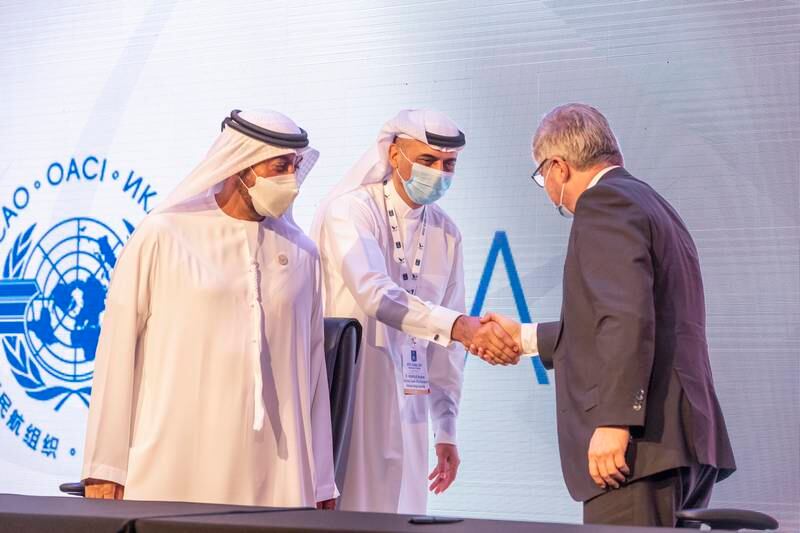 Emirates Group’s chief executive, Ahmed bin Saeed Al Maktoum, and Juan Carlos Salazar, ICAO secretary general, shake hands after signing an agreement. Photo: Antonie Robertson / The National