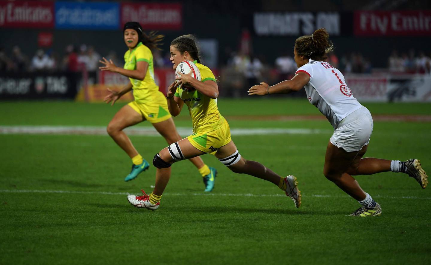 Australia's Dominique Du Toit sprints with the ball to score against the United States in the final of the World Rugby Women's Sevens Series in Dubai, the United Arab Emirates, Friday, Dec. 1, 2017. Australia beat the United States 0-34 victory (AP Photo/Martin Dokoupil)