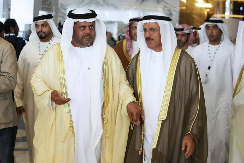 Arabtec chairman Mohamed Al Rumaithi, left, with the Minister of the Economy Sultan Al Mansouri during the 17th Arab Businessmen and Investors Conference in Abu Dhabi on Monday. Pawan Singh / The National