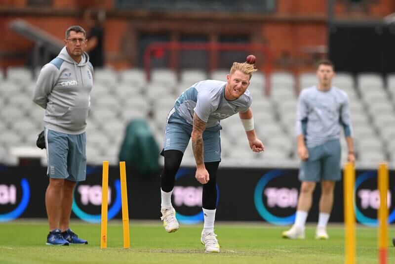 England captain Ben Stokes bowls as bowling coach Jon Lewis and Matthew Potts look on. Getty