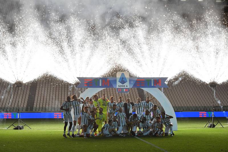 Juventus players celebrate winning their ninth consecutive Italian championship after the Serie A game against AS Roma at the Allianz stadium in Turin on Saturday, August 1. EPA