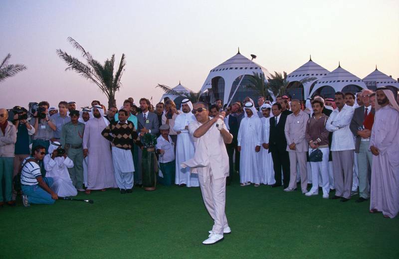 Pakistan President, General Zia Ul-Haq prepares to hit the commemorative tee shot after placing the golf ball on a golden tee in the presence of Sheikh Mohammed and Sheikh Maktoum to mark the opening of the Emirates Golf Club, the first green grass golf course in the Middle East on 1st March 1988 at the Emirates Golf Club in Dubai, United Arab Emirates. (Photo by David Cannon/Getty Images) 