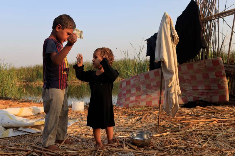 Children play at the Chebayesh marsh.