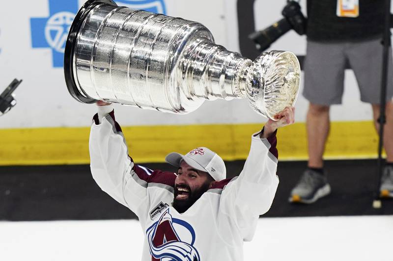 Colorado Avalanche centre Nathan MacKinnon lifts the Stanley Cup. AP Photo