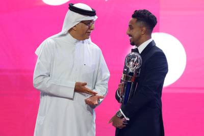 President of the Asian Football Confederation Sheikh Salman bin Ibrahim Al Khalifa with the AFC Player of the Year Salem Al Dawsari. AFP