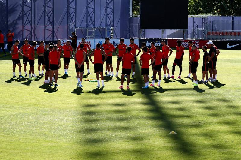 Atletico's players huddle as they prepare to face the Serie A champions Juventus.