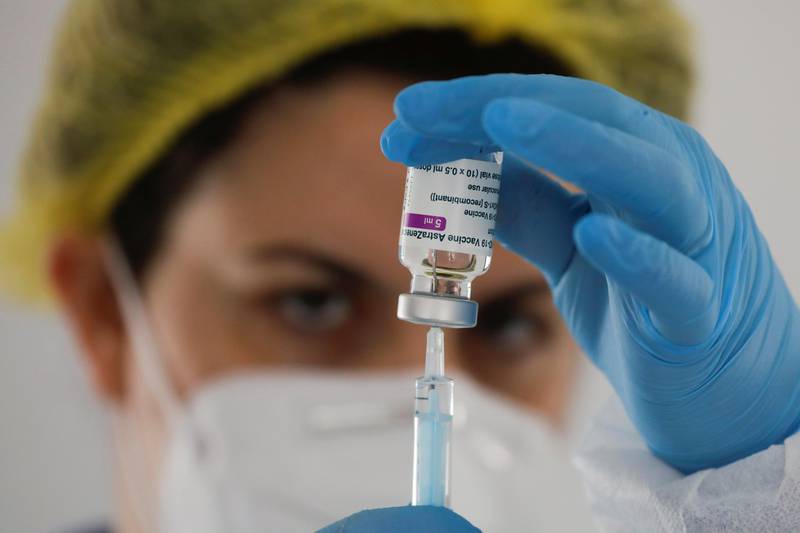 A healthcare worker prepares a dose of the AstraZeneca vaccine during a vaccination drive for teachers in Ronda, Spain. Reuters