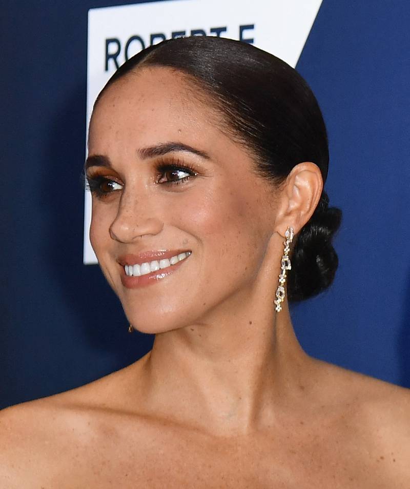 Meghan, Duchess of Sussex dazzled in a white off-the-shoulder dress.  AFP