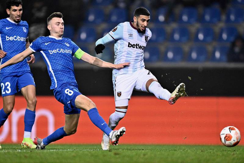 West Ham's Algerian forward Said Benrahma (R) shoots to score a goal during the UEFA Europa League Group H match between KRC Genk and West Ham United, at The Cegeka Arena in Genk, on November 4, 2021.  (Photo by JOHAN EYCKENS  /  Belga  /  AFP)  /  Belgium OUT