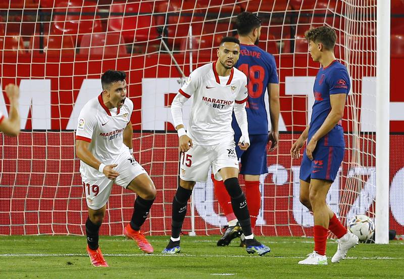 Sevilla's Marcos Acuna celebrates scoring against Atletico Madrid. Reuters
