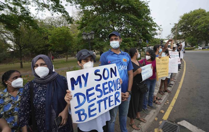 Sri Lankans participate in a protest in the capital Colombo, demanding the resignation of President Gotabaya Rajapaksa, shortly before the start of a nationwide curfew. AP