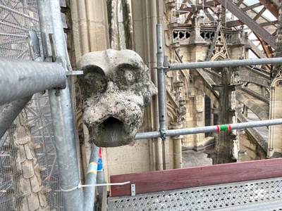 A gargoyle looks over Notre Dame as the restoration work continues. ABC News