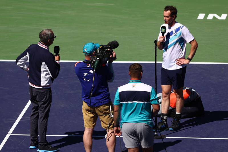 Andy Murray of Great Britain is interviewed for TV after winning his 700th tour victory against Taro Daniel of Japan. AFP

