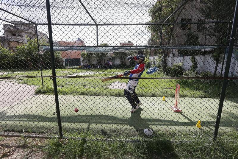 A cricketer bats during a nets session at the Baluwatar Cricket Club training centre in Kathmandu, Nepal. Pawan Singh / The National