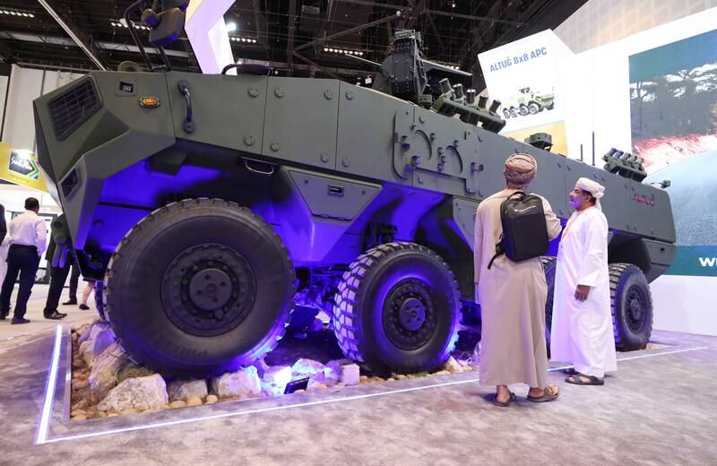 Visitors inspect an Altug 8x8 APC Armoured personnel carrier at Idex 2023 in Abu Dhabi. Chris Whiteoak / The National.