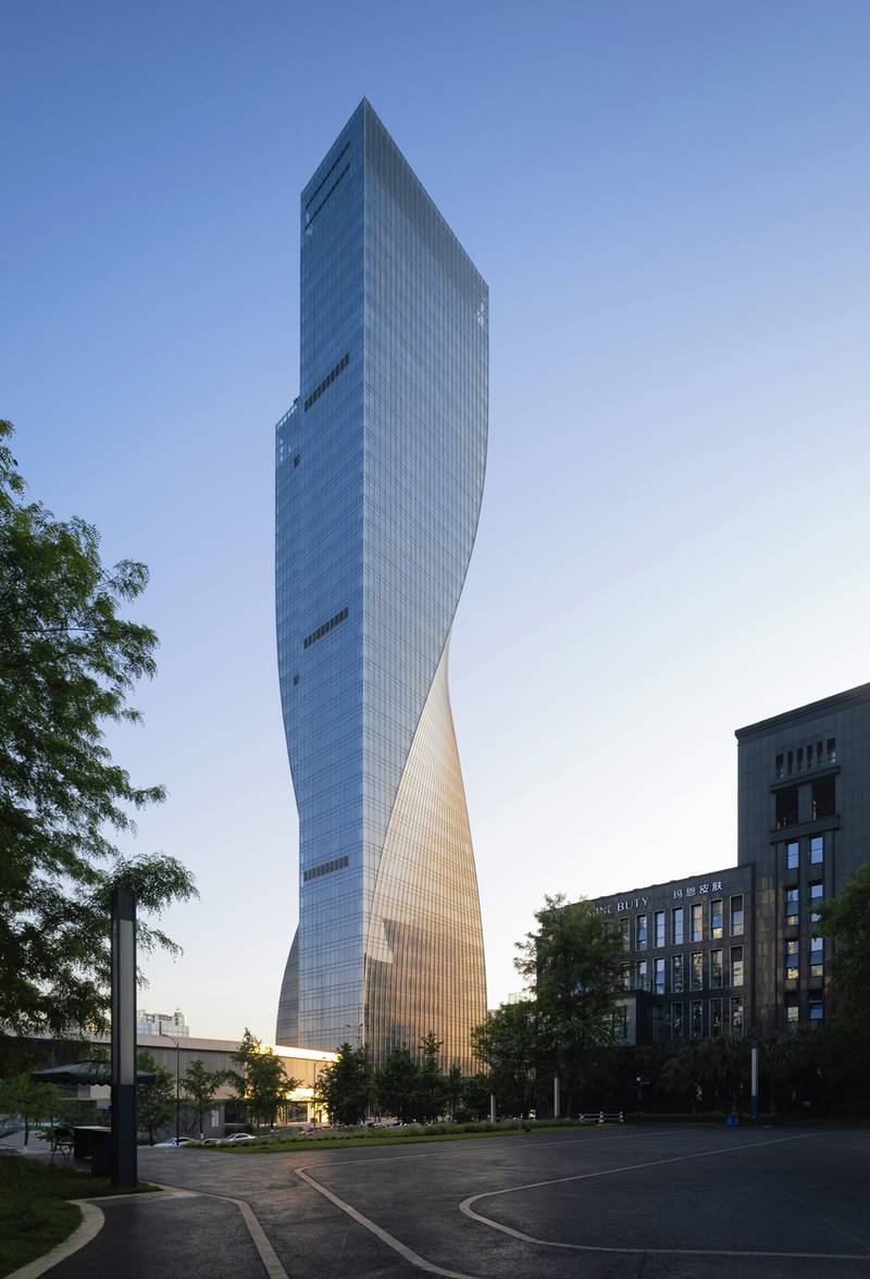 Designed by architecture studio Aedas, the tower has a minimalist design that uses both form and light to accentuate its twisting shape.