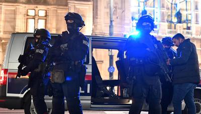 Armed policemen stand out of their car near the State Opera in the centre of Vienna following a terrorist attack. AFP