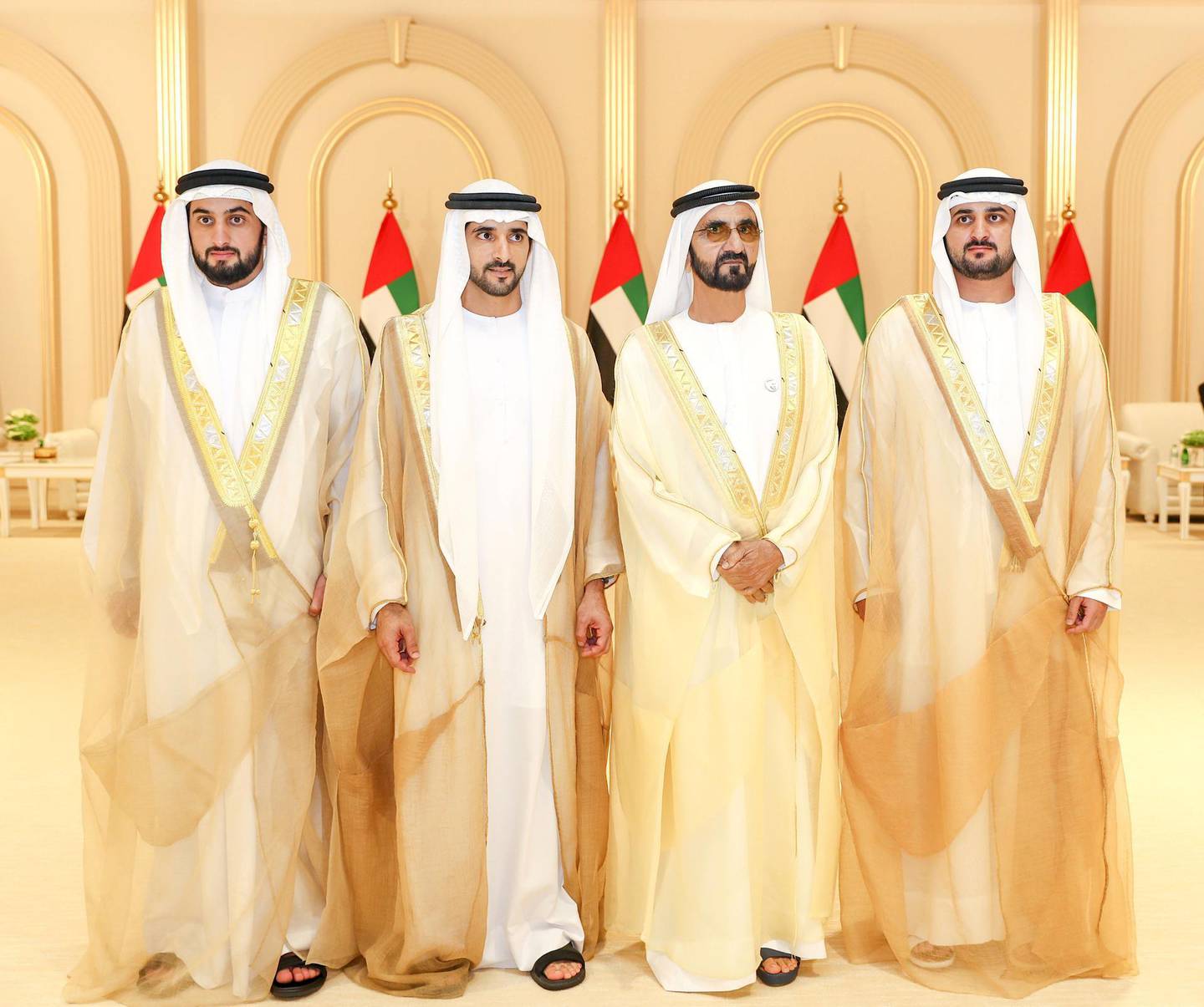 This handout picture provided by the UAE Ministry of Presidential Affairs on June 6, 2019 shows, Ruler of Dubai Sheikh Mohammed bin Rashid Al-Maktoum (2nd R), posing for a photograph with his sons, Crown Prince Sheikh Hamdan bin Mohammed (2nd L), Sheikh Maktoum bin Mohammed, (R), and Sheikh Ahmed bin Mohammed, on their wedding day in Dubai. (Photo by - / UAE Ministry of Presidential Affairs / AFP) / XGTY / RESTRICTED TO EDITORIAL USE - MANDATORY CREDIT "AFP PHOTO / UAE MINISTRY OF PRESIDENTIAL AFFAIRS - NO ADVERTISING CAMPAIGNS - DISTRIBUTED AS A SERVICE TO CLIENTS