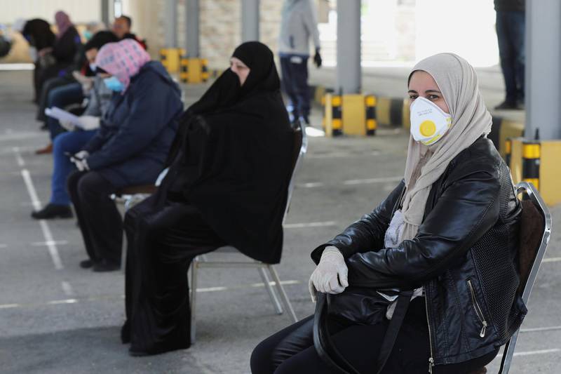 A queue of people wait for testing by volunteer doctors as part of initiative that was launched with the aim of providing Jordanians with field medical services, amid concerns over the spread of the coronavirus, in Amman, Jordan. Reuters