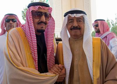 A handout picture released by the Saudi Press Agency (SPA) shows Saudi King Salman bin Abdulaziz Al-Saud (L) holding hands with Bahraini Prime Minister Khalifa bin Salman Al-Khalifa at the Al-Sakhir Palace in Manama on December 8, 2016. (Photo by HO / SPA / AFP) / RESTRICTED TO EDITORIAL USE - MANDATORY CREDIT "AFP PHOTO / SPA" - NO MARKETING - NO ADVERTISING CAMPAIGNS - DISTRIBUTED AS A SERVICE TO CLIENTS
