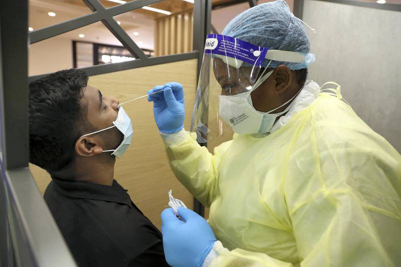 DUBAI, UNITED ARAB EMIRATES , October 14 – 2020 :- Anto Antony giving his COVID-19 nasal swab test at the COVID 19 testing station set up at Mall of the Emirates in Dubai. (Pawan Singh / The National) For News/Online. Story by Sarwat