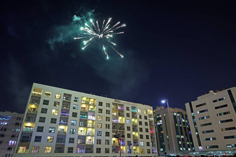 Fireworks light the sky above a decorated building in Bur Dubai. AFP