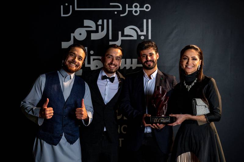 Saudi film director Hamzah Jamjoom, producer Aymen Khoja, and actors Fayez Bin Jurays and Sumaya Rida pose with their Best Saudi Film award for 'Rupture'. Photo: Red Sea International Film Festival / AFP