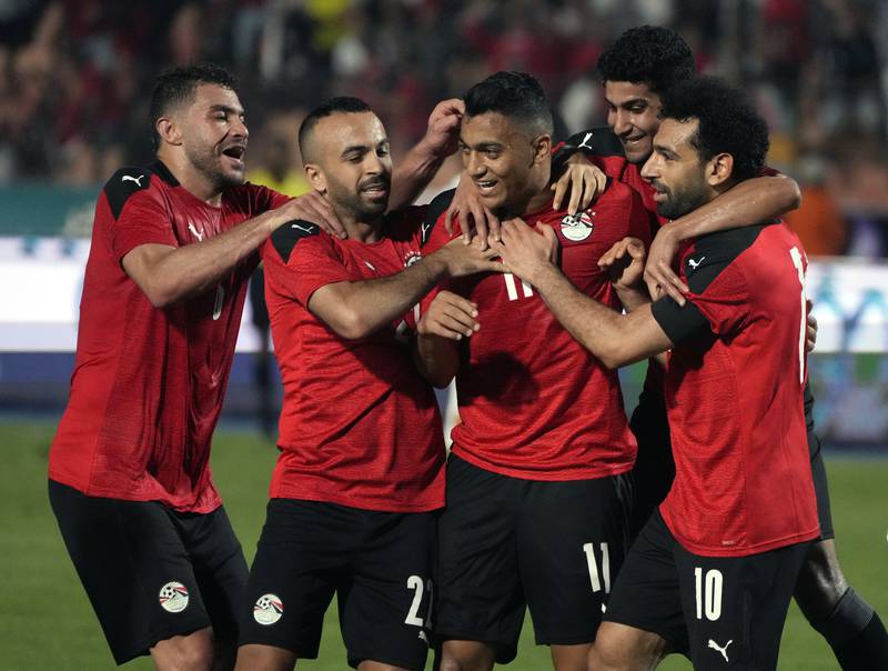Egypt players celebrate after Mostafa Mohamed scores against Guinea. AP