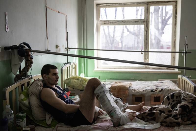 Oleh Smolin, 23, who suffered leg injuries from Russian shelling in April 2022, in hospital in Chuhuiv. Getty Images