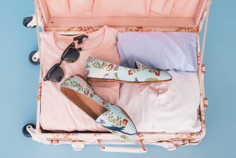 Capsule wardrobes, itineraries and fewer shoes can all help make packing for your summer holidays a breeze. Photo: Arnel Hasanovic / Unsplash