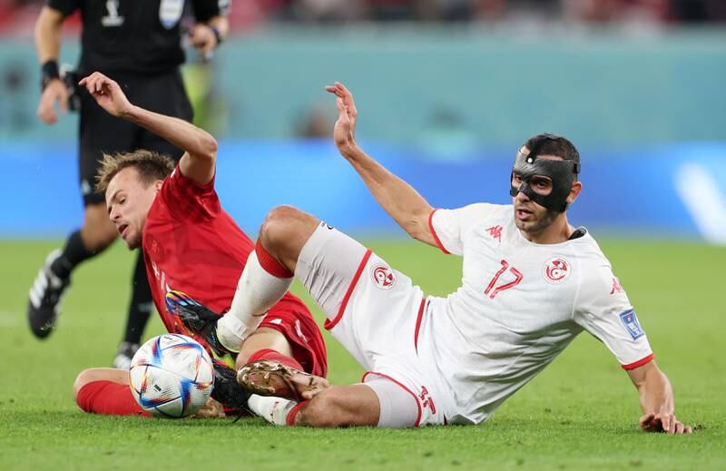 Tunisia's Ellyes Skhiri and Mikkel Damsgaard of Denmark battle for the ball. Getty