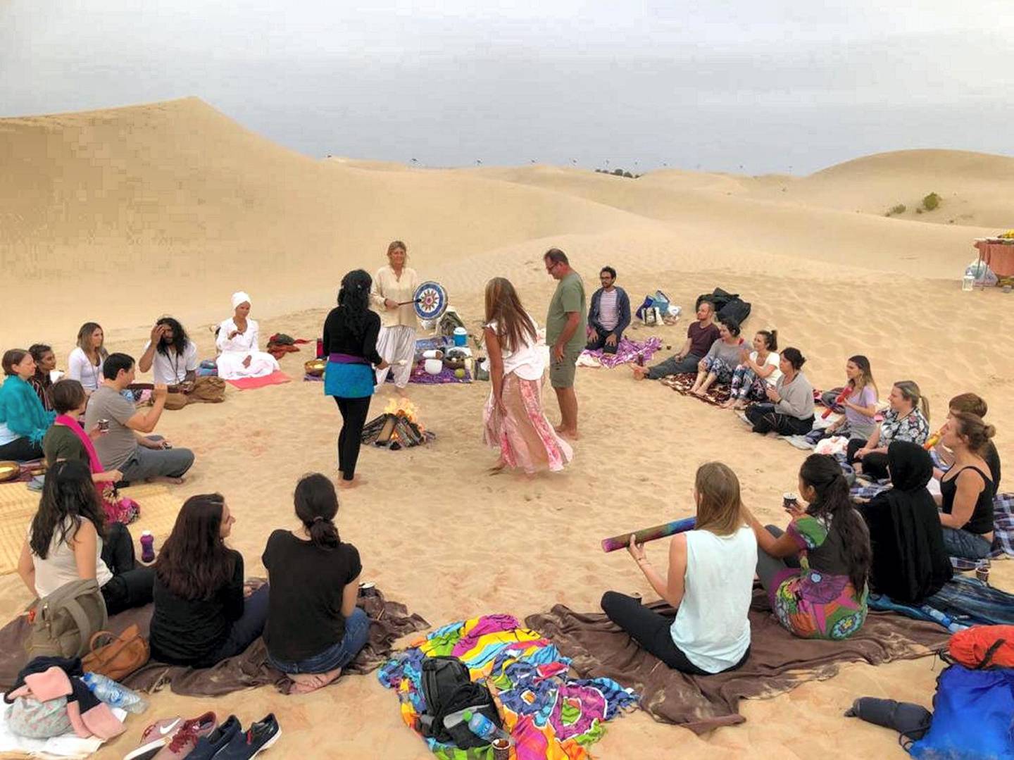 A cacao ceremony led by Lara Skadsen, a vibrational energy practitioner from Abu Dhabi, during which liquid cacao is consumed while participants share stories. Courtesy Lara Skadsen 