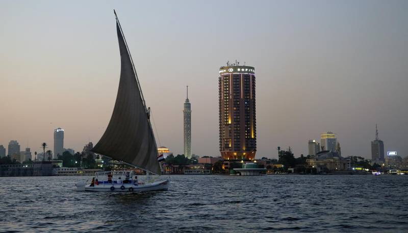 A sailboat on the Nile river with the Cairo Tower and Sofitel Cairo Nile El Gezirah hotel in the background. EPA