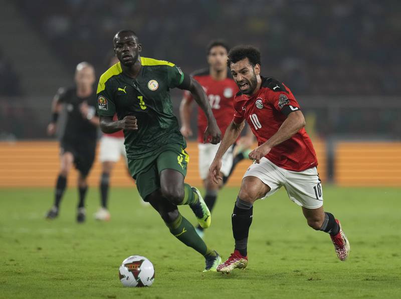 Senegal's Kalidou Koulibaly, left, challenges Egypt's Mohamed Salah in Yaounde. AP