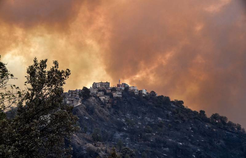 Smoke rises from a wildfire in the hills of the Kabylie region, east of the capital Algiers, Algeria.