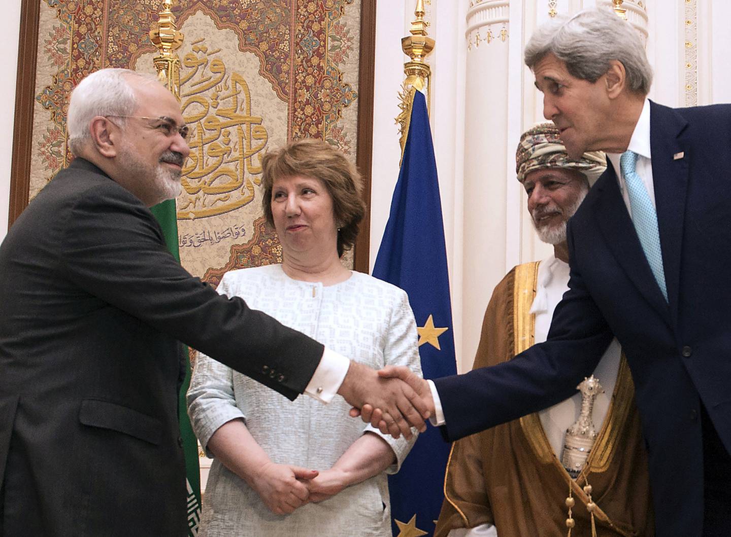 US Secretary of State John Kerry, right, greets Iranian Foreign Minister Javad Zarif in 2009 in Muscat, as Omani minister responsible for foreign affairs Yussef bin Alawi and former EU diplomat Catherine Ashton look on. AFP