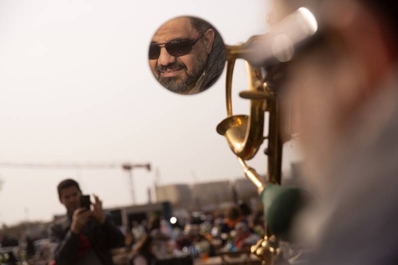 Egyptian vintage car collector Mohamed Wahdan, 52, is reflected in the mirror of his 1924 Ford T at a classic car show in Cairo. The car once belonged to Egypt's King Farouk.