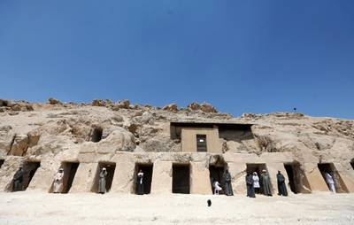 Workers standing inside the gates of one of the largest newly discovered tombs 'Shedsu Djehuty' in Luxor, Egypt. Reuters