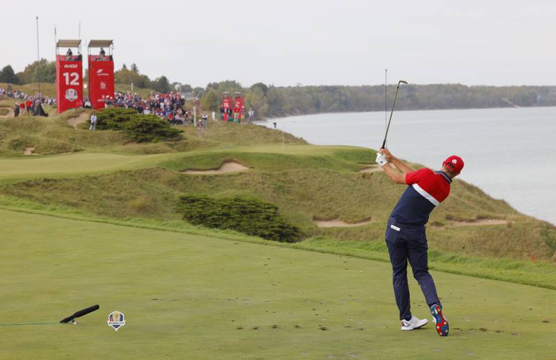 USA's Dustin Johnson hits his tee shot on the 12th hole. Reuters