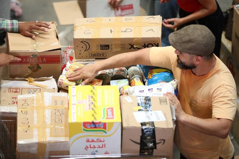 Volunteers packing aid boxes in Al Quoz, Dubai, for survivors of the earthquake