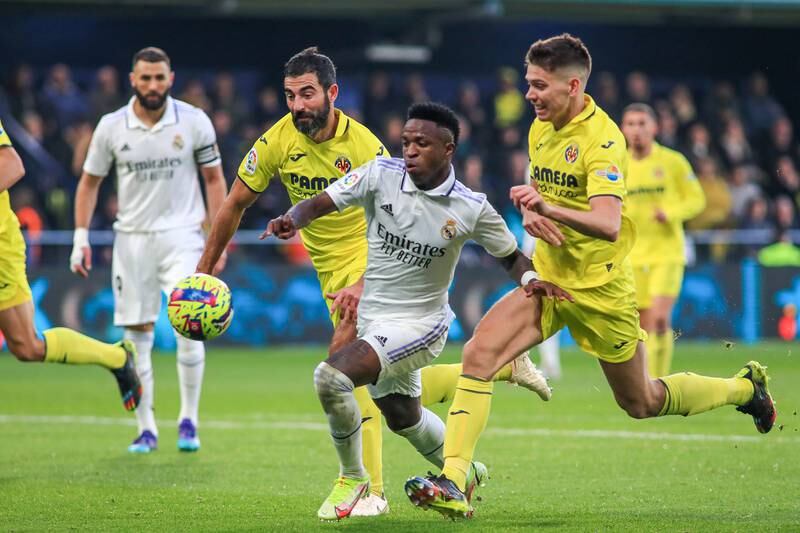 Villarreal's defenders Raul Albiol (L) and Juan Foyth battle for the ball with Madrid's Brazilian striker Vinicius Junior. EPA