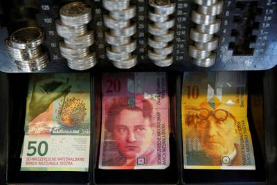 FILE PHOTO - The new 50 Swiss Franc note is seen at a market stall after its release by the Swiss National Bank (SNB) in Bern, Switzerland April 12, 2016.  REUTERS/Ruben Sprich/File Photo  GLOBAL BUSINESS WEEK AHEAD