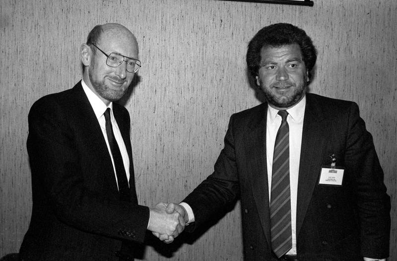 Sir Clive Sinclair shaking hands with Sir Alan Sugar, then head of Amstrad Consumer Electronics, after it was announced that Amstrad had bought all rights to sell Sinclair computers worldwide in 1986. PA