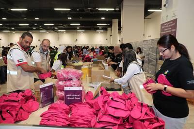 Volunteers pack kits for children during the Dubai Cares Back to School campaign at the Jafza One Convention Centre in Jebel Ali. All photos: Pawan Singh / The National