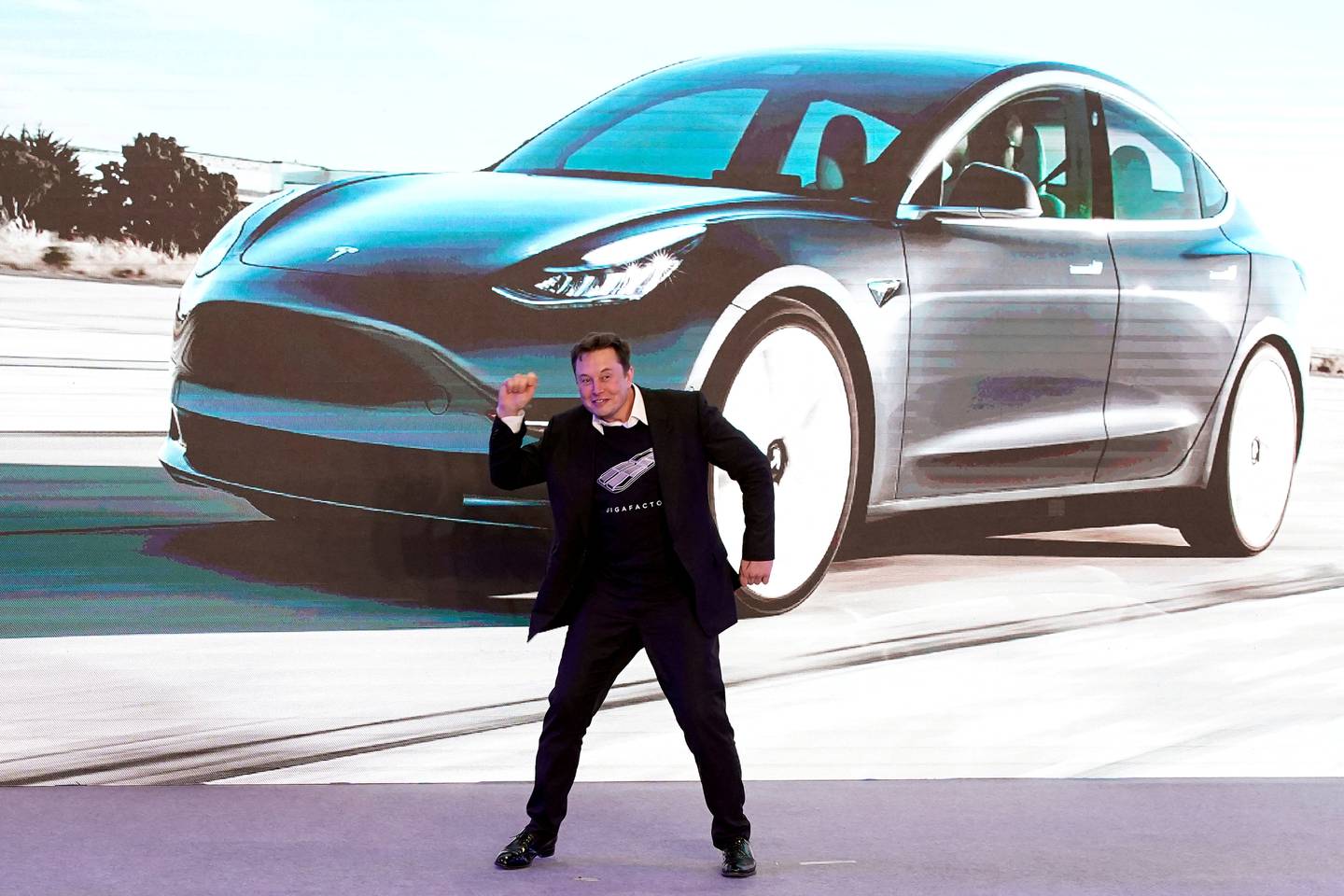 Tesla chief executive Elon Musk dances onstage during a delivery event for China-made Model 3 cars in Shanghai. Reuters