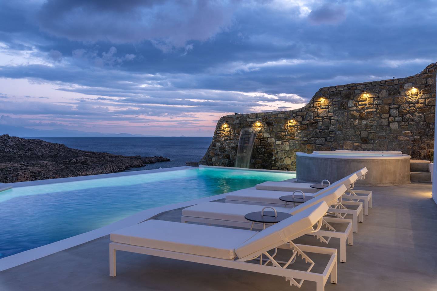 Mountain and sea views from the pool at dusk. Courtesy Engel and Voelkers