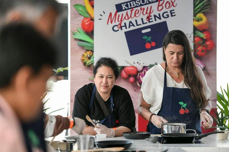 Visitors participate in the Kibsons Cooking Challenge at Taste of Dubai food festival. All photos: Khushnum Bhandari / The National